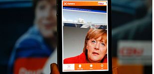 Merkel en la aplicación para smartphone lanzada en la campaña de las elecciones generales. Merkel en la aplicación para smartphone lanzada en la campaña de las elecciones generales.