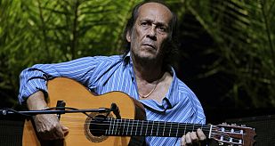 File photo of Spanish flamenco guitarist de Lucia playing a guitar during a rehearsal of closing concert of the Biennial of Flamenco in Seville