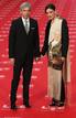 Spanish actor Imanol Arias and his girlfriend pose as they arrive for the Spanish Film Academys Goya awards ceremony at Madrids Royal Theatre