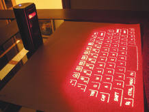 Un teclado virtual creado mediante un láser que detecta dónde colocas los dedos Un teclado virtual creado mediante un láser que detecta dónde colocas los dedos