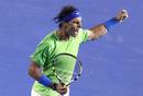 El espa&ntilde;ol Rafa Nadal celebra su victoria en el cuarto set ante el serbio Novak Djokovic