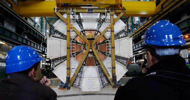 The last element of the ATLAS experiment is lowered into the cave at the CERN in Meyrin near Geneva