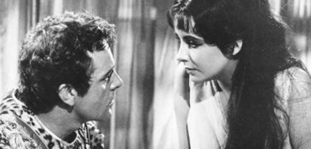 Actress Elizabeth Taylor and Richard Burton are shown in a scene from her 1963 film Cleopatra