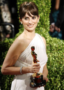 Actress Penelope Cruz poses at the 2009 Vanity Fair Oscar Party with the award Cruz won for best supporting actress for her role in "Vicky Cristina Barcelona" in West Hollywood