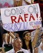 A fan holds up a banner for Spains Nadal during his mens singles final match against Switzerlands Federer at the Australian Open
