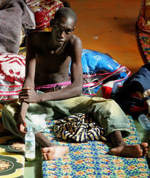 African would-be immigrant sits inside a camp in Oujda