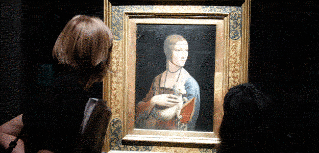 Journalists look at painting "Dame mit dem Hermelin" by Leonardo da Vinci at Bode museum in Berlin