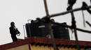 An Indian commando takes position in the neighbouring building of 