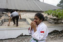An injured girl cries during an evacuation after an earthquake hit Padang, Indonesias Sumatra island
