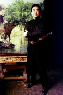 Artist Chen Yifei poses in his studio in Shanghai December 20, 1996. Chen, best known for his almost..