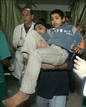 Wounded Palestinian is carried into hospital after Israeli air strike in Gaza