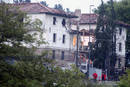 Police walk past the Civil Guard barracks where a car bomb exploded in Legutiano.