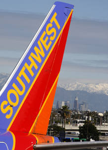 A Southwest Airlines aircraft is seen in front of downtown Los Angeles A Southwest Airlines aircraft is seen in front of downtown Los Angeles