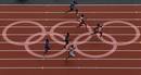 Athletes compete in round 1 of the mens 100m heats at the London 2012 Olympic Games at the Olympic Stadium