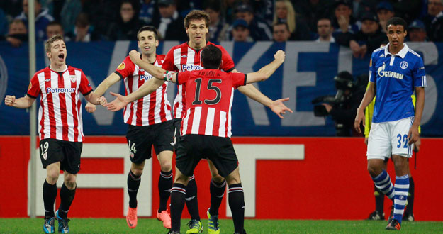 Athletic Bilbao's Llorente and Iraola celebrate a goal against Schalke 04 during the Europa League quarter-final match in Gelsenkirchen