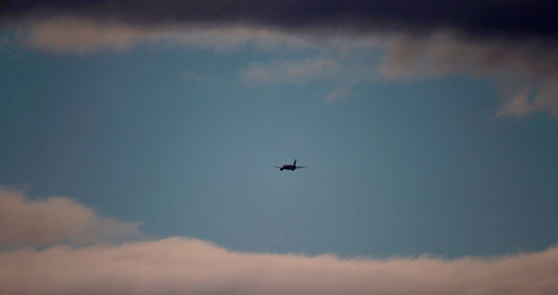 An Iberia passenger aircraft flying between clouds prepares to land at Madrid's Barajas Airport An Iberia passenger aircraft flying between clouds prepares to land at Madrid's Barajas Airport
