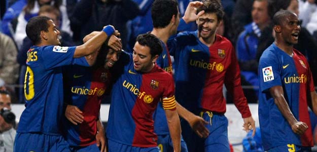 Barcelona's Keita is congratulated by team mates after scoring against Recreativo Huelva in Huelva