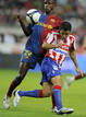 Barcelonas Abidal is challenged by Sporting Gijons Maldonado during their Spanish first division match in Gijon