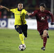Barcelonas Alves challenges Rubin Kazans Dominguez during their Champions League soccer match at the Central stadium in Kazan