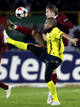 Barcelonas Alves challenges Rubin Kazans Ryazantsev during their Champions League soccer match at the Central stadium in Kazan,