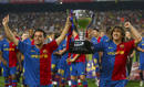 Barcelonas captains Hernandez and Puyol celebrate with their Spanish first division soccer league trophy in Barcelona