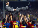 Barcelonas coach Guardiola is tossed by players during celebrations of Spanish first division soccer league win in Barcelona