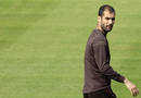 Barcelonas coach Josep Guardiola looks at journalists during a training session at 