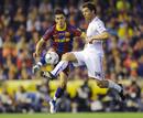 Barcelonas David Villa jumps for the ball against Real Madrids Alonso during their the Kings Cup final soccer match in Valencia