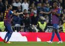Barcelonas Eric Abidal celebrates his goal with teammate Dani Alves against Real Madrid during their Spanish Kings Cup soccer match in Madrid