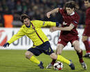 Barcelonas Messi challenges Rubin Kazans Sharonov during their Champions League soccer match at the Central stadium in Kazan