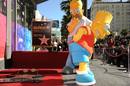 Bart y Homert Simpson celebran el &eacute;xito de su creador Matt Groening