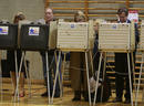 Bill Ayers checks his ballot as he casts his vote in Chicago