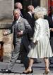 Britains Prince Charles and his wife Camilla, Duchess of Cornwall arrive for the wedding between Zara Phillips and Mike Tindall at Canongate Kirk in Edinburgh