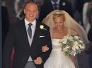 Britains Zara Phillips and her husband Mike Tindall leave after their marriage at Canongate Kirk in Edinburgh