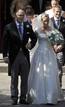 Britains Zara Phillips and her husband Mike Tindall leave after their marriage at Canongate Kirk in Edinburgh