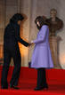 Frances first lady Carla Bruni-Sarkozy and U.S. first lady Michelle Obama hold hands as they arrive for the visit of the Strasbourgs Cathedral