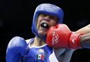 Canadas Clayton lands a punch as he fights against Mexicos Molina Casillas in the mens welter (69kg) Round of 32 boxing match during the London 2012 Olympic Games