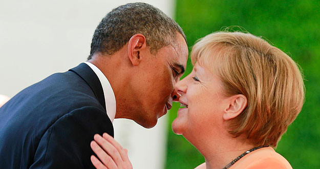 U.S. President Obama embraces German Chancellor Merkel outside the Chancellery in Berlin