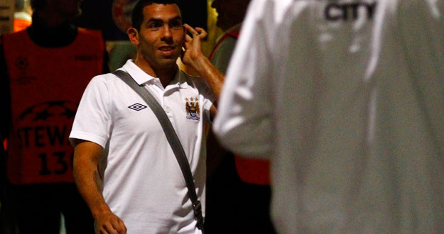 Carlos Tevez of Manchester City walks towards his team's bus after the Champions League Group A soccer match against Bayern Munich in Munich