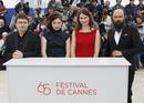 Cast members Stratan and Flutur attend a photocall for the film Dupa Dealuri by director Mungiu in competition at the 65th Cannes Film Festival
