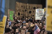Demonstrators from the Occupy Wall Street campaign hold signs aloft as a protest march enters the courtyard near the New York Police Department headquarters in New York Demonstrators from the Occupy Wall Street campaign hold signs aloft as a protest march enters the courtyard near the New York Police Department headquarters in New York