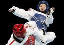 Chinas Wu Jingyu kicks Spains Brigitte Yague Enrique during their womens -49kg gold medal taekwondo match during the London 2012 Olympic Games at the ExCeL arena