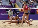 Chinas Xue Chen and Zhang Xi try to save the ball against Russias Ekaterina Khomyakova during their womens round of 16 beach volleyball match at Horse Guards Parade during the London 2012 Olympic Games