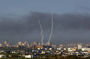 Trails of smoke are seen after launch of rockets from Gaza