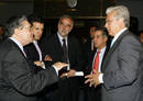Colombias Interior Minister Cossio speaks to International Criminal Court Chief Prosecutor Moreno-Ocampo during Moreno-Ocampos visit in Bogota