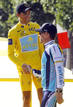 Astana rider and leaders yellow jersey Contador shakes hands with teammate Armstrong after the final stage of the Tour de France cycling race
