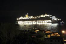 A cruise ship that ran aground is seen off the west coast of Italy at Giglio island