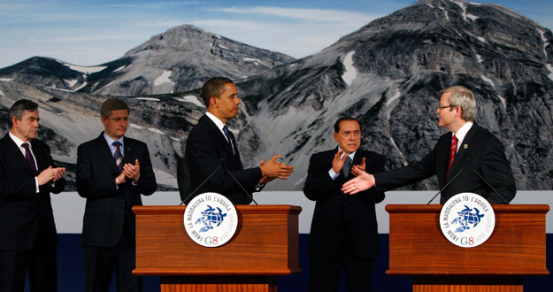 Australia's PM Rudd offers his hand to US President Obama as other leaders clap at the G8 summit in L'Aquila