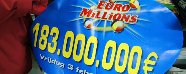 A customer selects numbers on a "EuroMillions" lottery ticket in a shop in Brussels