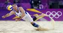 Czech Republics Petr Benes dives for the ball during their mens preliminary round beach volleyball match against Todd Rogers and Phil Dalhausser of the U.S. at Horse Guards Parade during the London 2012 Olympic Games
